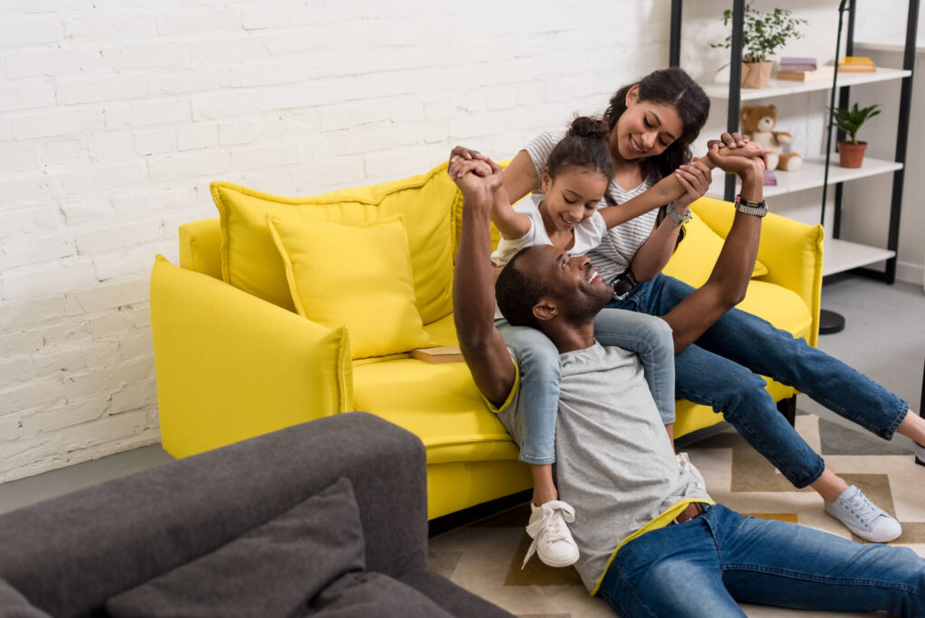 family in living room after Upholstery cleaning in Jupiter FL